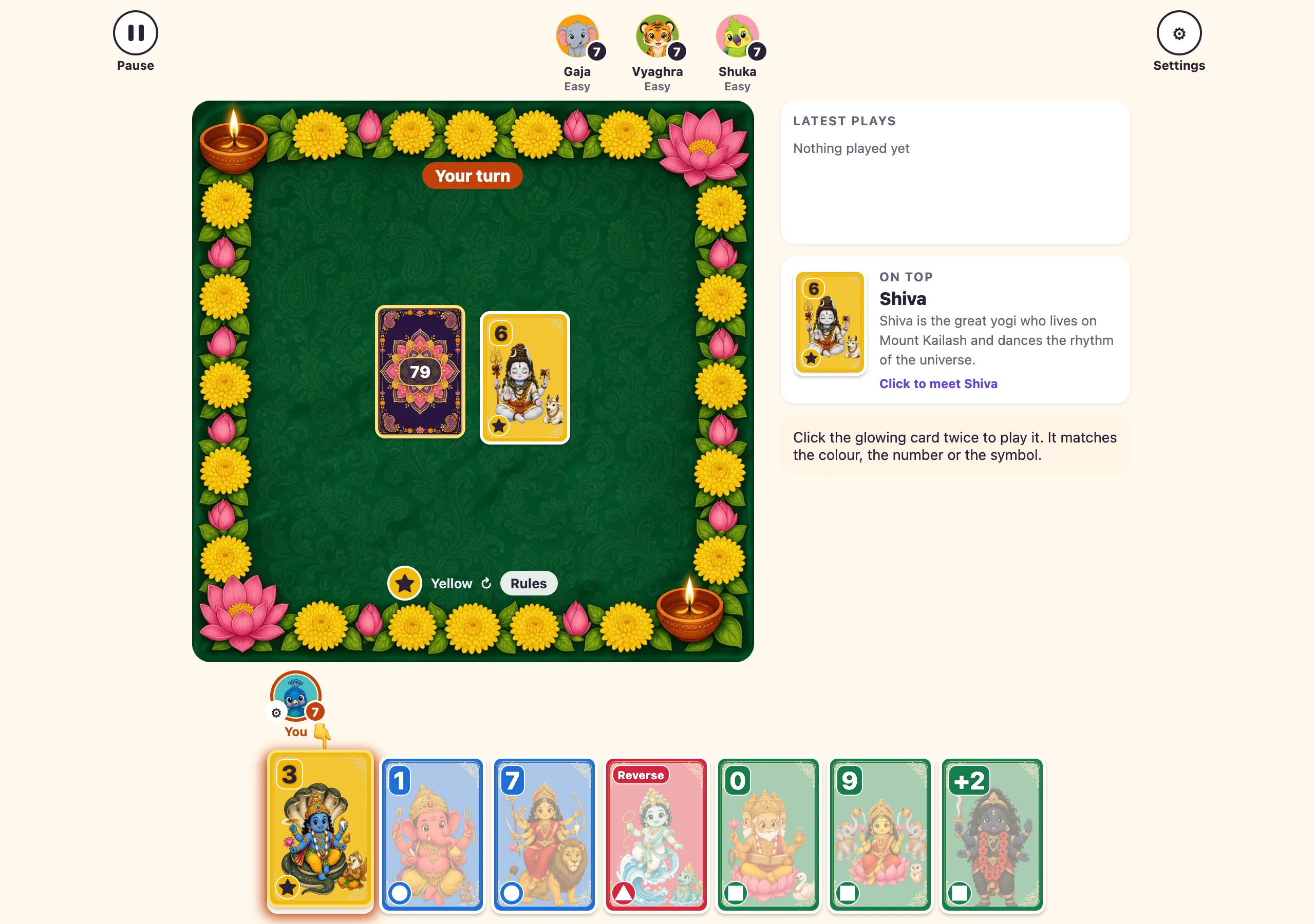 The Ekam table: a green felt board ringed with marigolds and lotuses, the draw pile and a Shiva 6 face up, and a hand of seven cards along the bottom